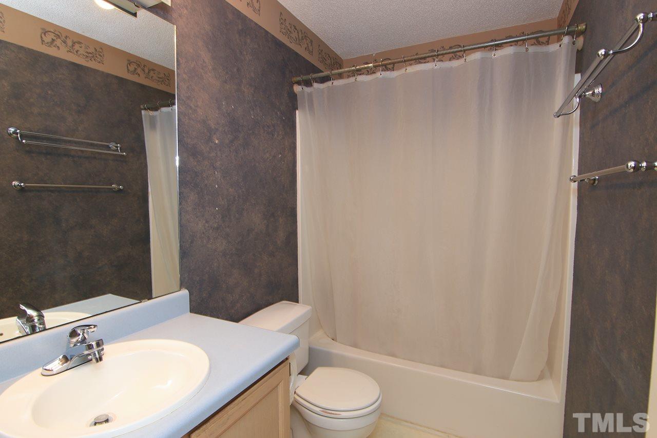 2305 Merganzer Road Raleigh, NC 27616 - Photo 8 of 10 a bathroom with a sink toilet and shower