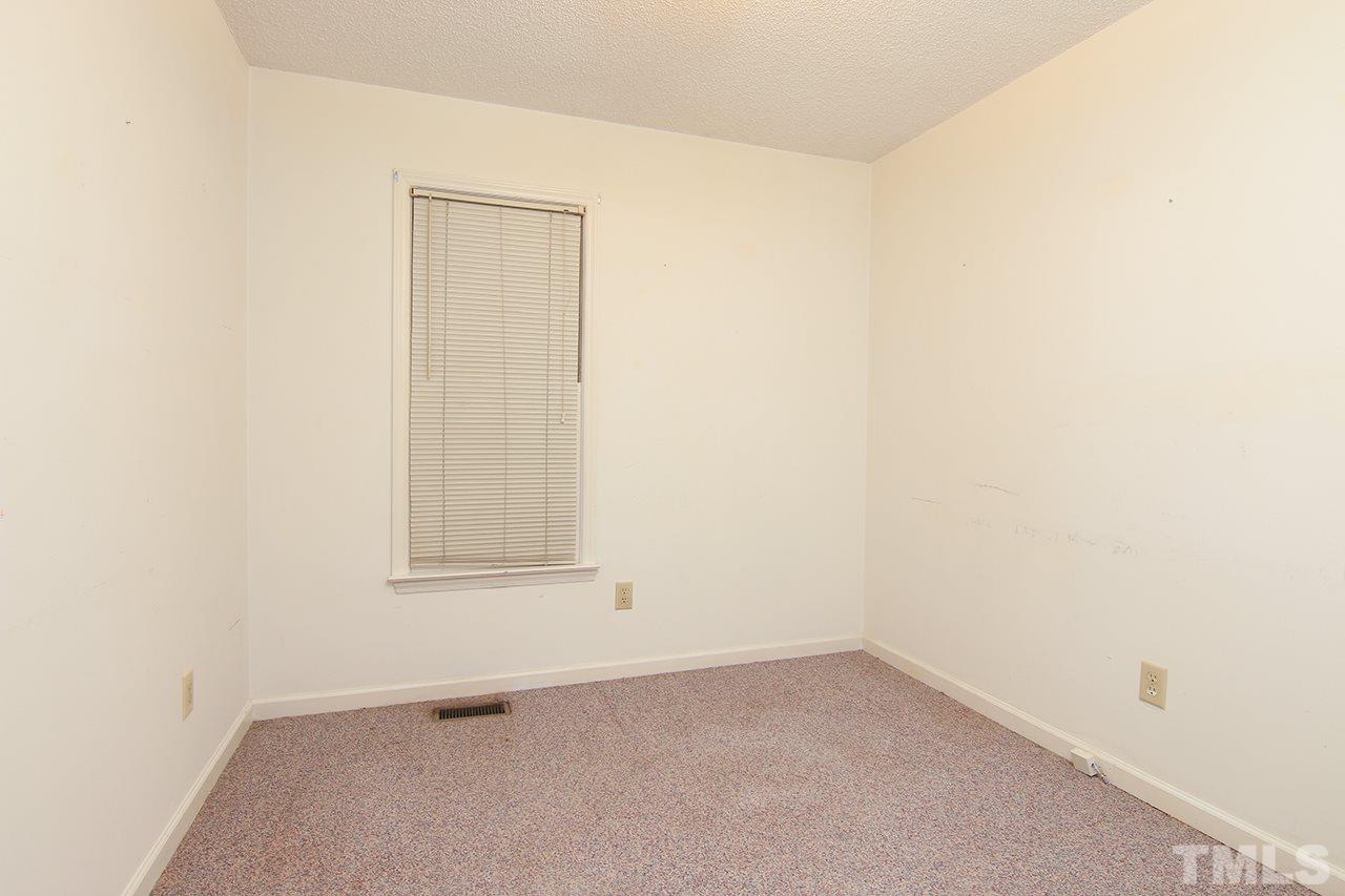 2305 Merganzer Road Raleigh, NC 27616 - Photo 9 of 10 an empty room with a window