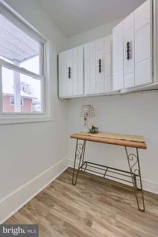 a view of cabinets and wooden floor