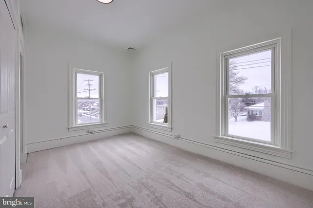 a view of an empty room with a window