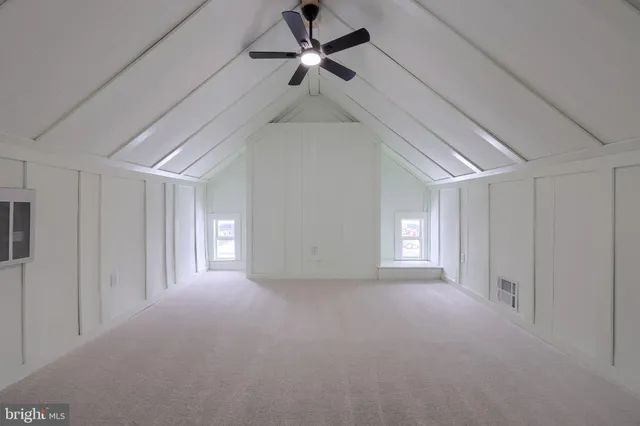 a view of empty room with windows