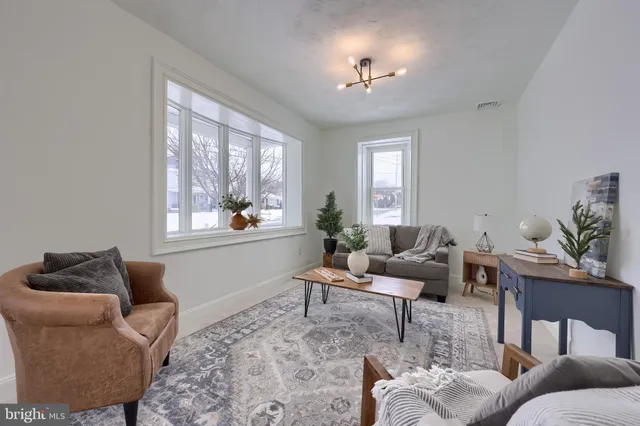 a living room with furniture and window