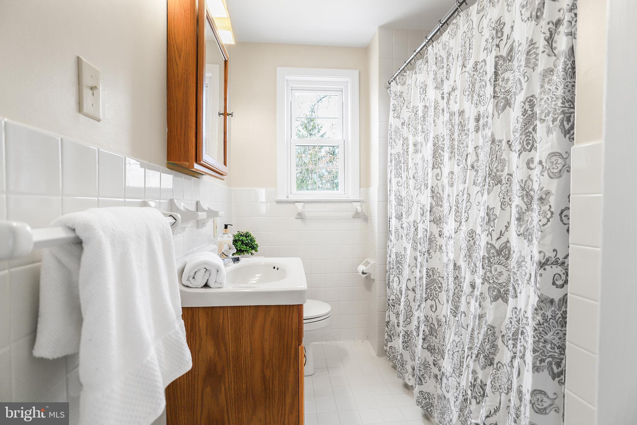 317 East Rodgers Street Ridley Park, PA 19078 - Photo 16 of 24 a bathroom with a sink toilet and window