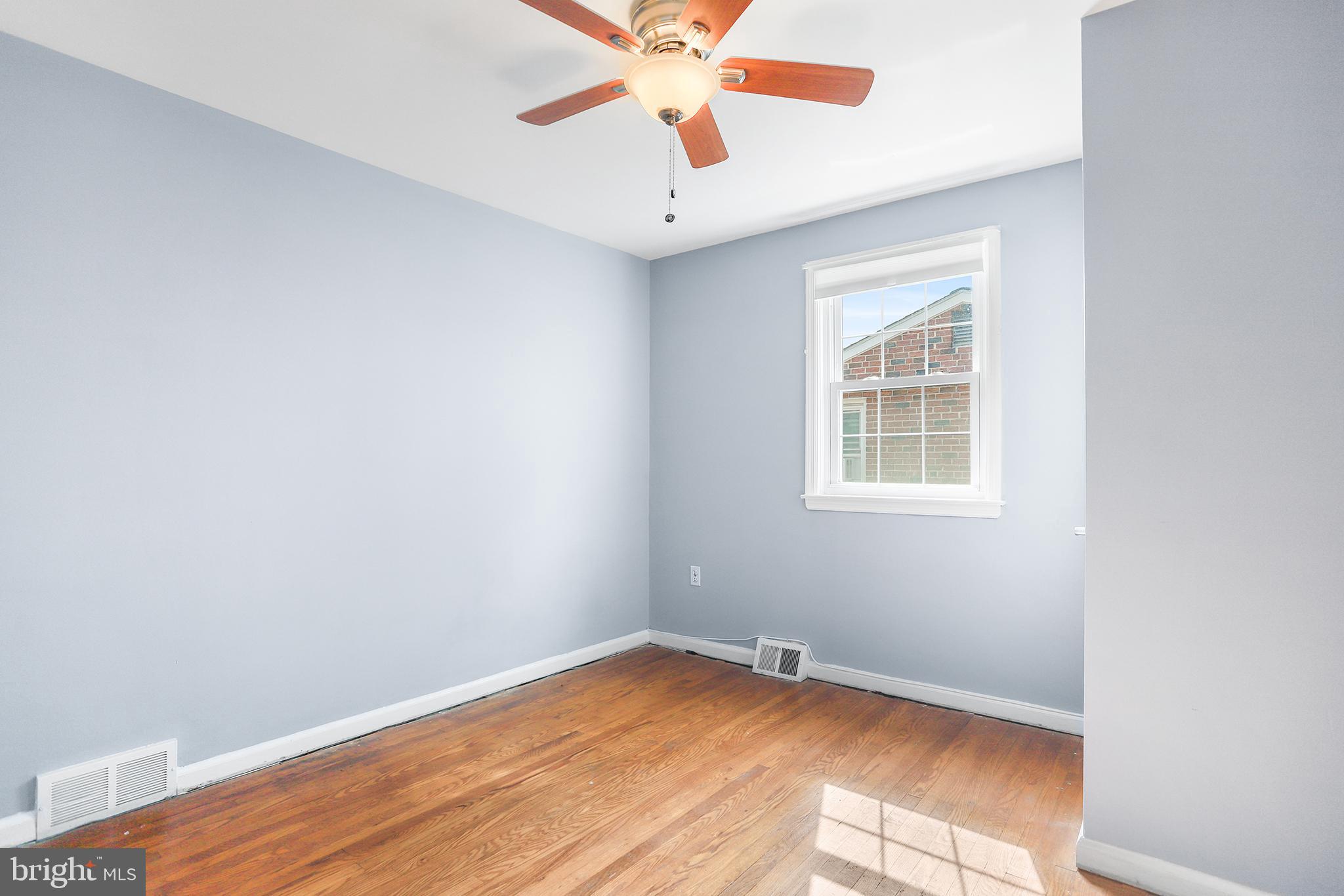317 East Rodgers Street Ridley Park, PA 19078 - Photo 18 of 24 an empty room with a window and a fan