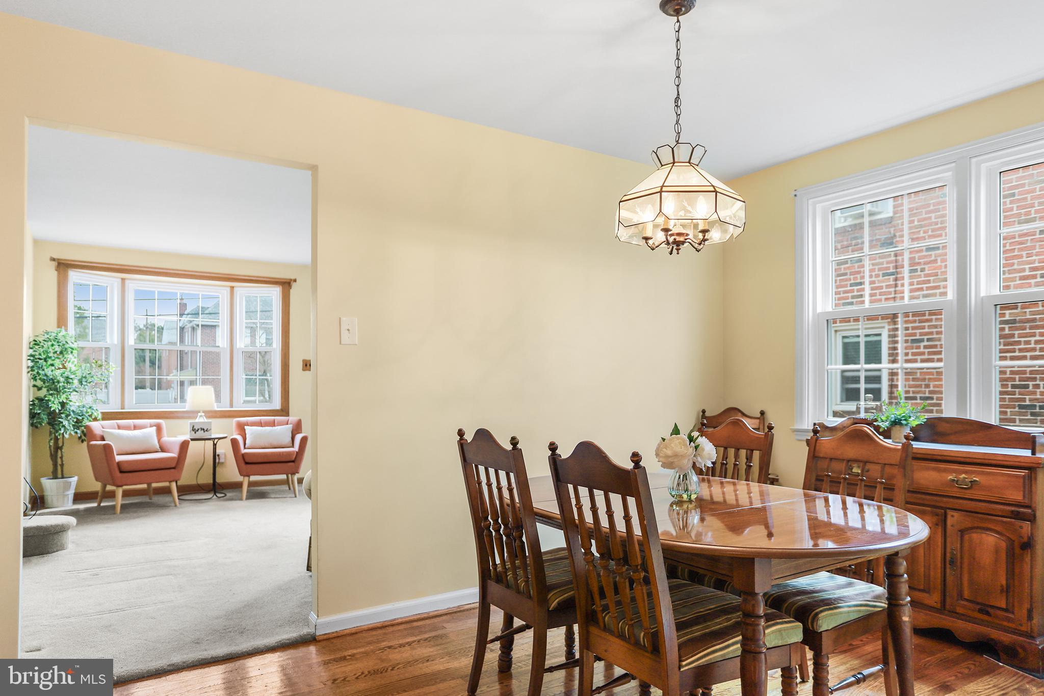 317 East Rodgers Street Ridley Park, PA 19078 - Photo 6 of 24 a dining room with furniture a chandelier and wooden floor