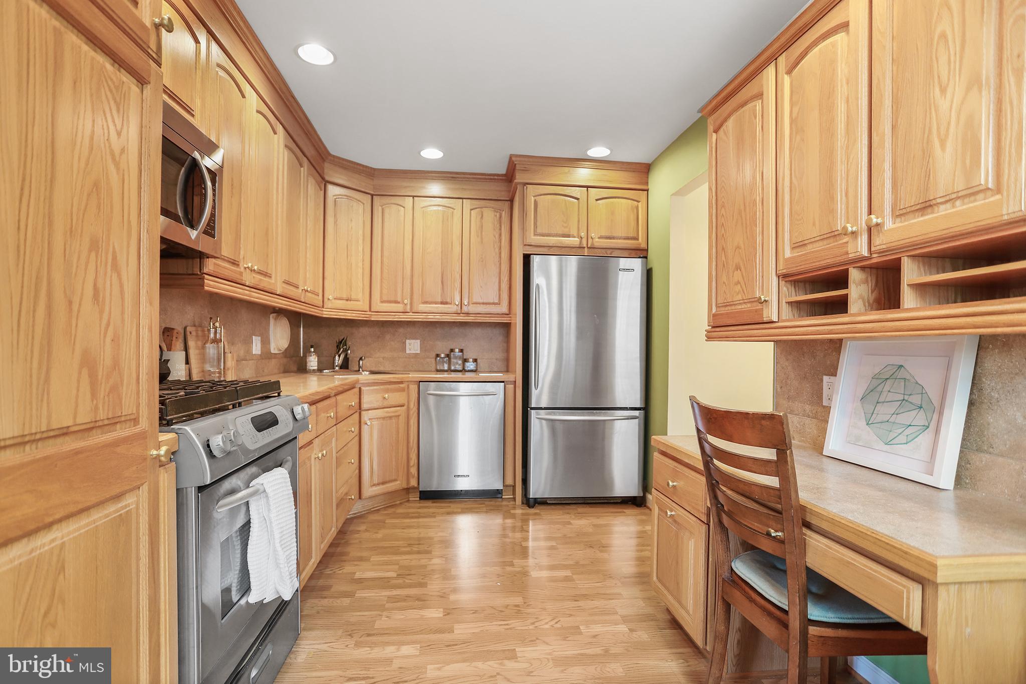 317 East Rodgers Street Ridley Park, PA 19078 - Photo 8 of 24 a kitchen with stainless steel appliances granite countertop a refrigerator a stove and a sink
