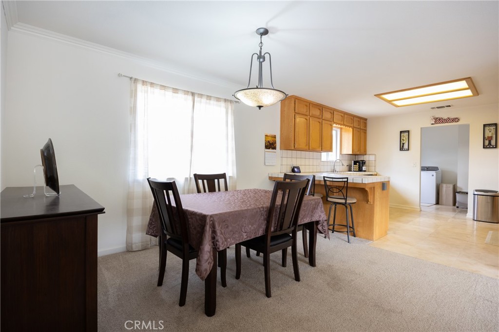 30142 Revis Road Coarsegold, CA 93614 - Photo 9 of 43 a view of a dining room with furniture and window