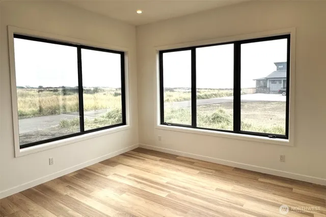 a view of a livingroom with wooden floor