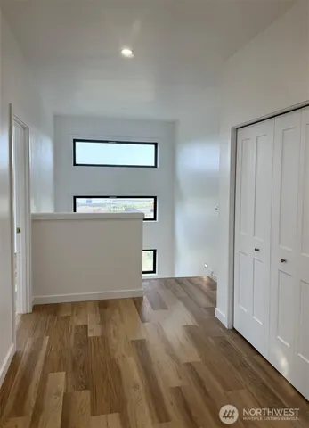 a spacious bathroom with a sink a vanity and a mirror