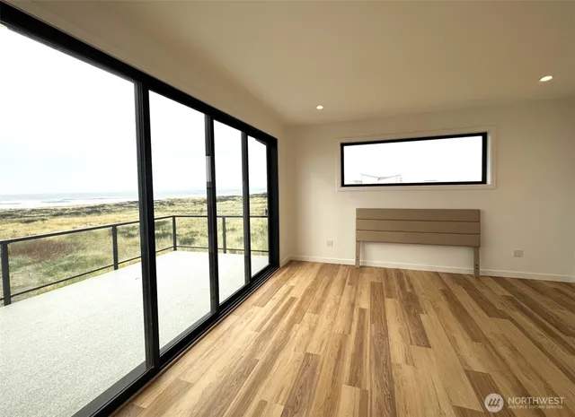 a spacious bathroom with a granite countertop sink a mirror and shower