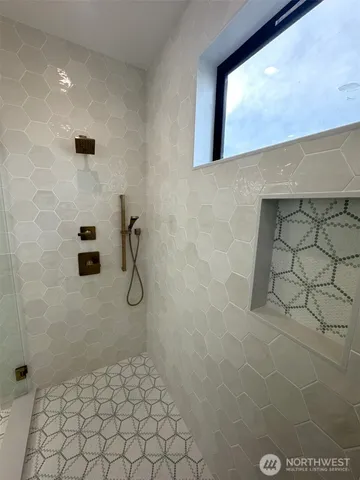 a bathroom with a toilet and a bathtub