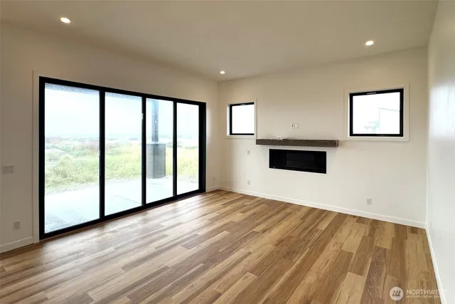 a kitchen with stainless steel appliances a stove a sink and a refrigerator