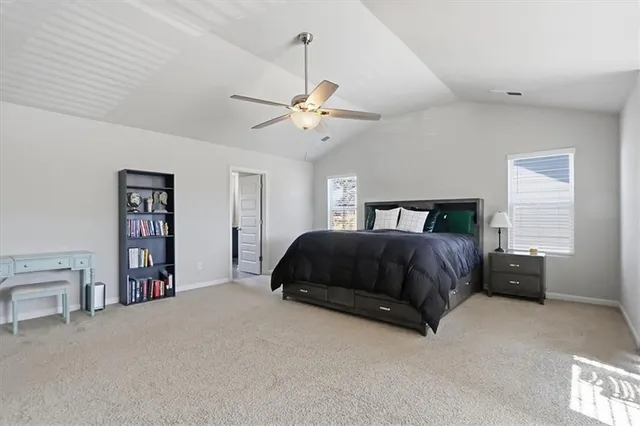 an empty room with wooden floor and natural light