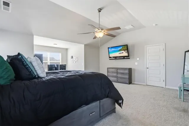 a view of a room with wooden floor and windows