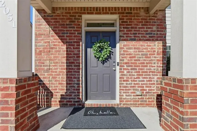a view of an entryway with wooden floor