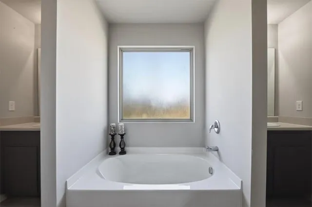 a bathroom with a sink toilet and mirror