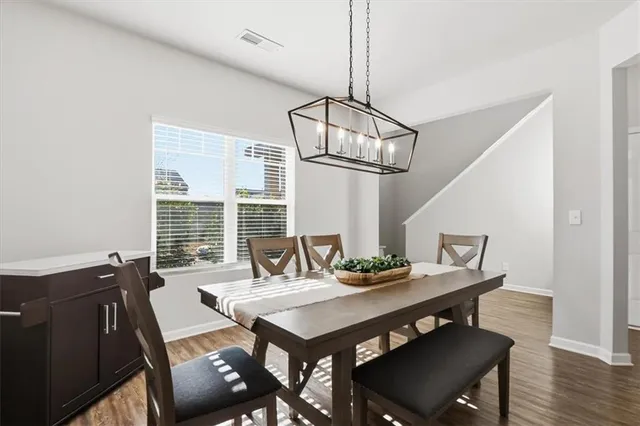 a view of a dining room with furniture window and outside view