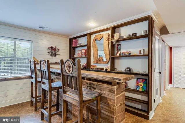 a view of a dining room with furniture and window