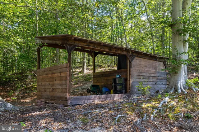 a view of a park with wooden fence
