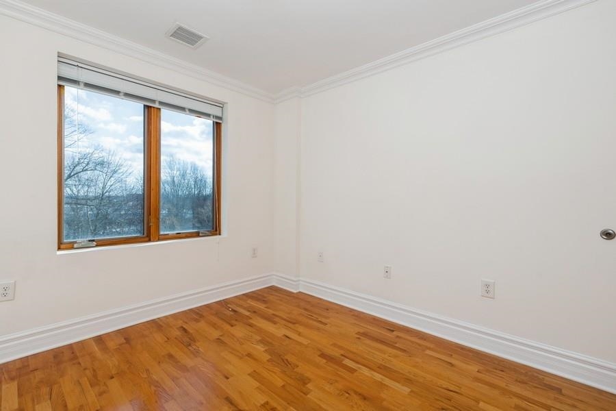 17 Meadow Road, Unit 405 Rutherford, NJ 07070 - Photo 13 of 21 a view of empty room with wooden floor and fan