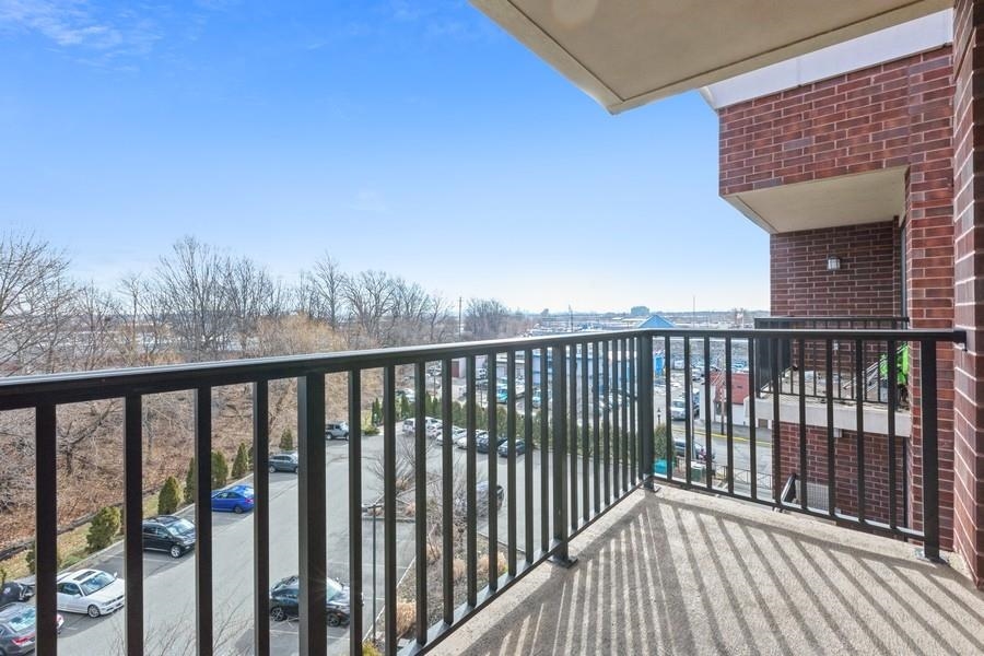 17 Meadow Road, Unit 405 Rutherford, NJ 07070 - Photo 6 of 21 a view of city from a balcony
