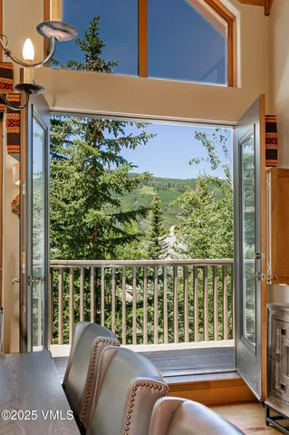 a balcony with table and chairs