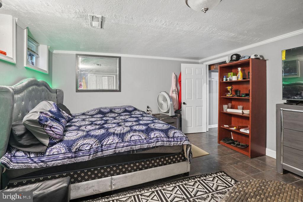 1918 Church Road Baltimore, MD 21222 - Photo 21 of 29 a bedroom with a bed and a closet