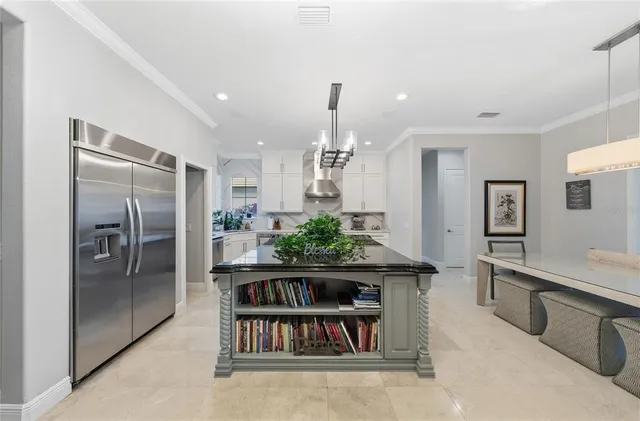 a spacious bathroom with a tub sink and mirror