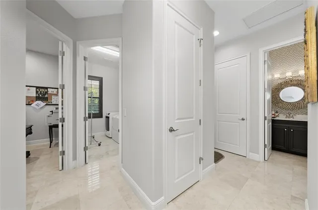 a bathroom with a granite countertop sink a toilet a mirror and shower