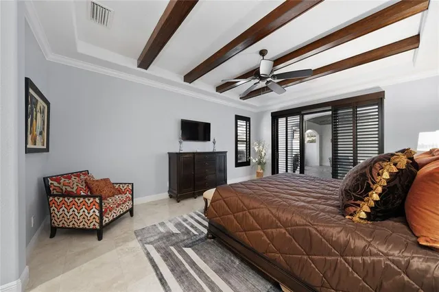 a bedroom with a bed and a clock on the wall