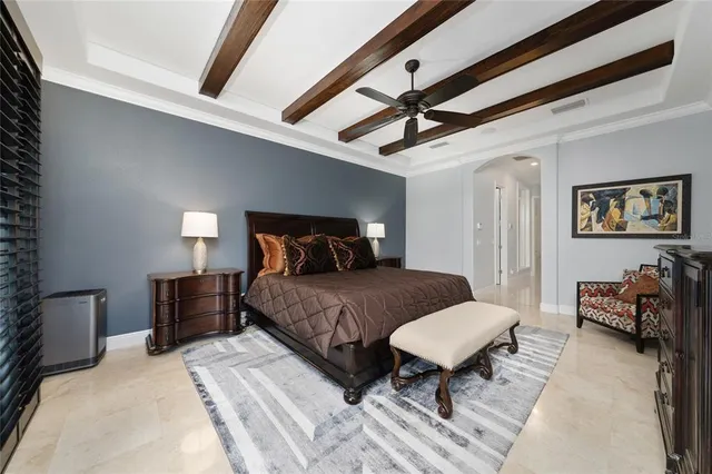 a bathroom with a granite countertop sink a toilet a large mirror and shower