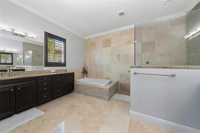 a living room with lots of furniture and a chandelier