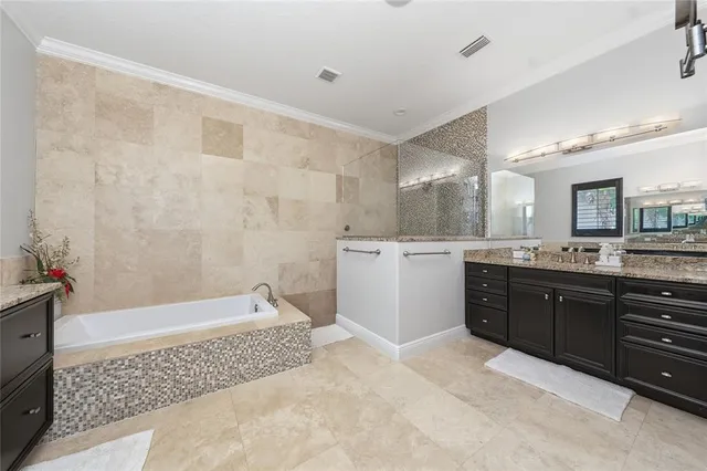 a view of a patio with table and chairs under an umbrella