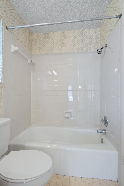 12314 Furrow Cove, Unit A Austin, TX 78753 - Photo 18 of 23 Full bath featuring shower / washtub combination, a textured ceiling, and tile patterned floors