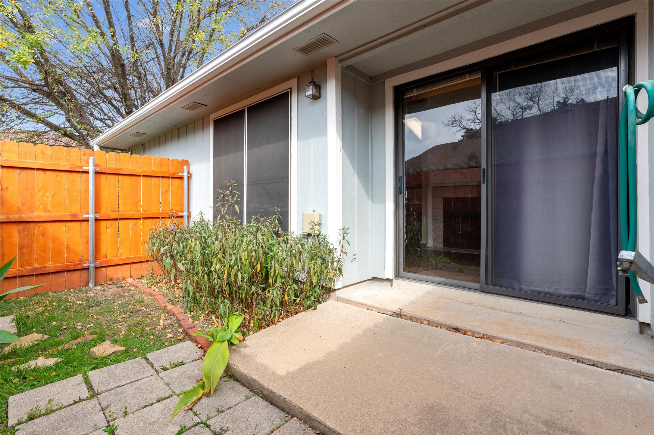 12314 Furrow Cove, Unit A Austin, TX 78753 - Photo 19 of 23 View of exterior entry with a patio