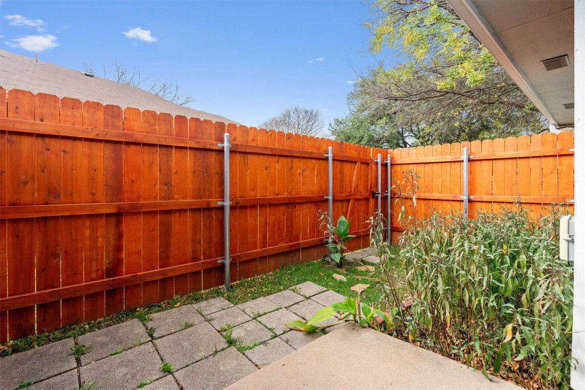 12314 Furrow Cove, Unit A Austin, TX 78753 - Photo 20 of 23 Fenced backyard featuring a patio