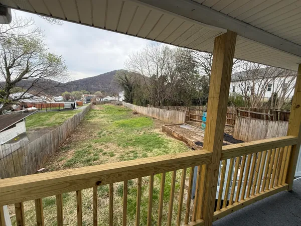 a view of balcony and yard