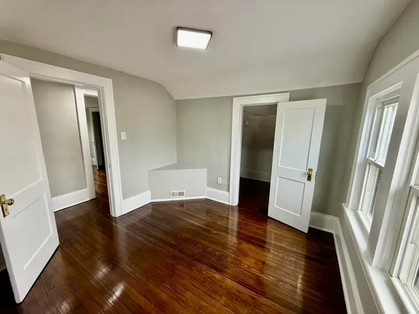 a view of balcony with wooden floor