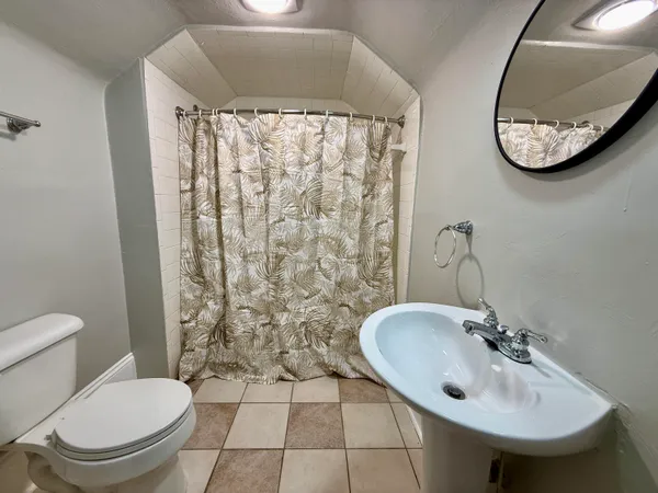a bathroom with a toilet and a sink