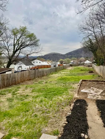 a view of a pathway with a yard