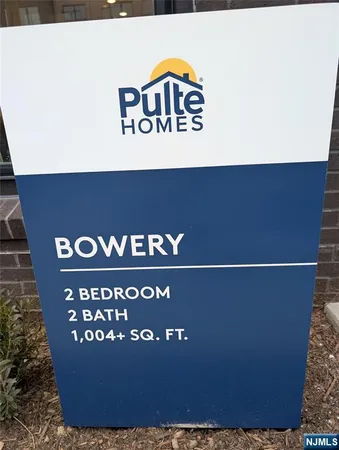 a building outdoor space with patio furniture and potted plants