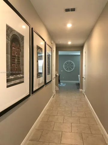 a view of an empty room with a fireplace