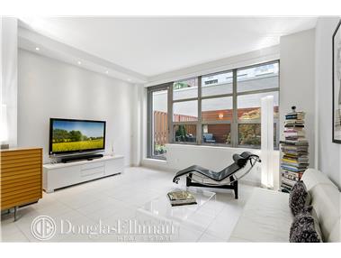 a living room with furniture tv and a large window