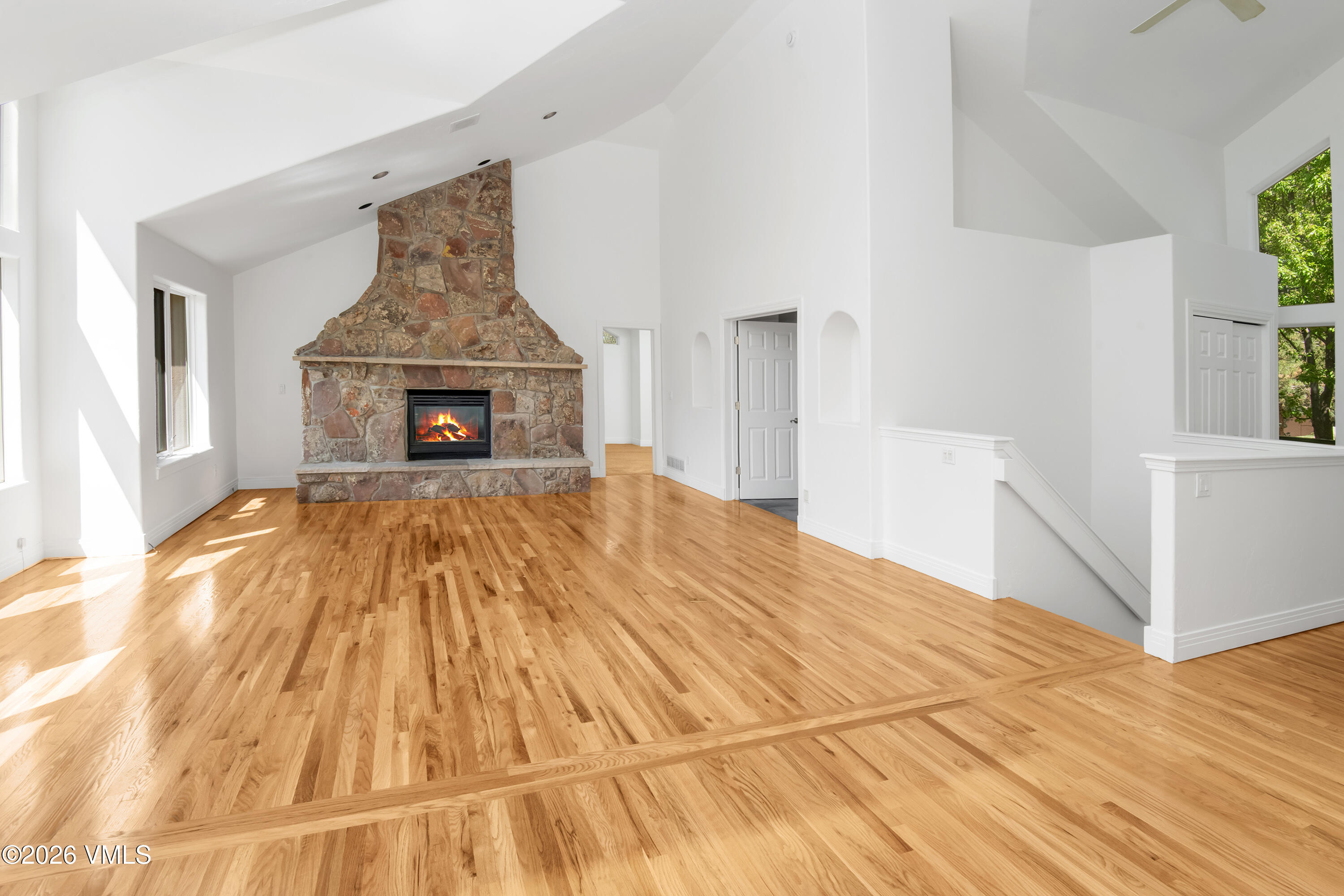471 Rawhide Road Edwards, CO 81632 - Photo 3 of 51 a view of empty room with wooden floor and fireplace