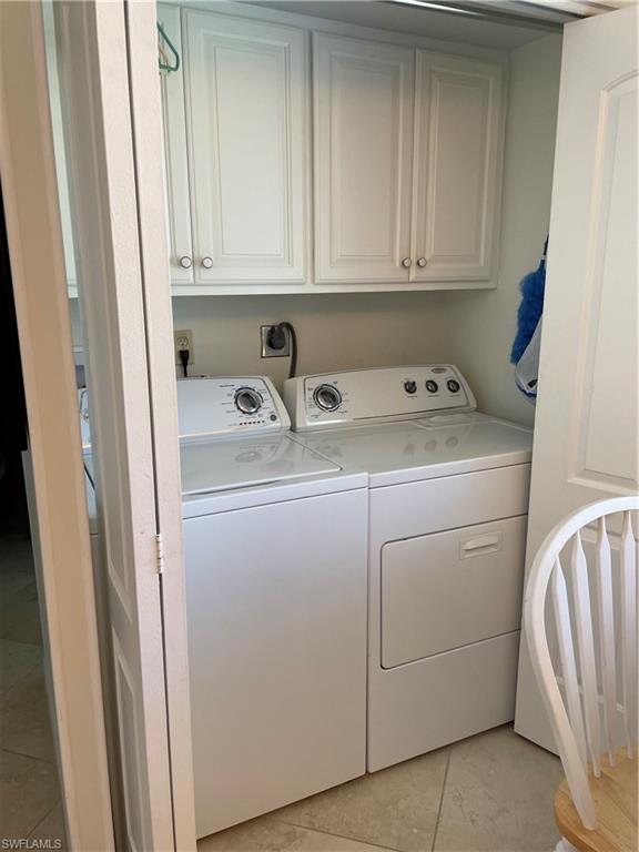 284 Winners Circle, Unit 4 Naples, FL 34112 - Photo 11 of 27 Laundry in kitchen