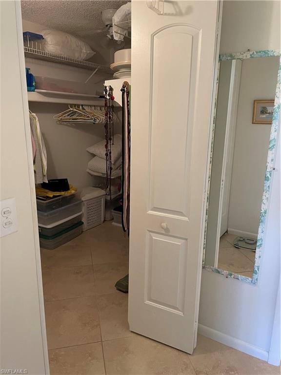 284 Winners Circle, Unit 4 Naples, FL 34112 - Photo 19 of 27 Master walk-in closet
