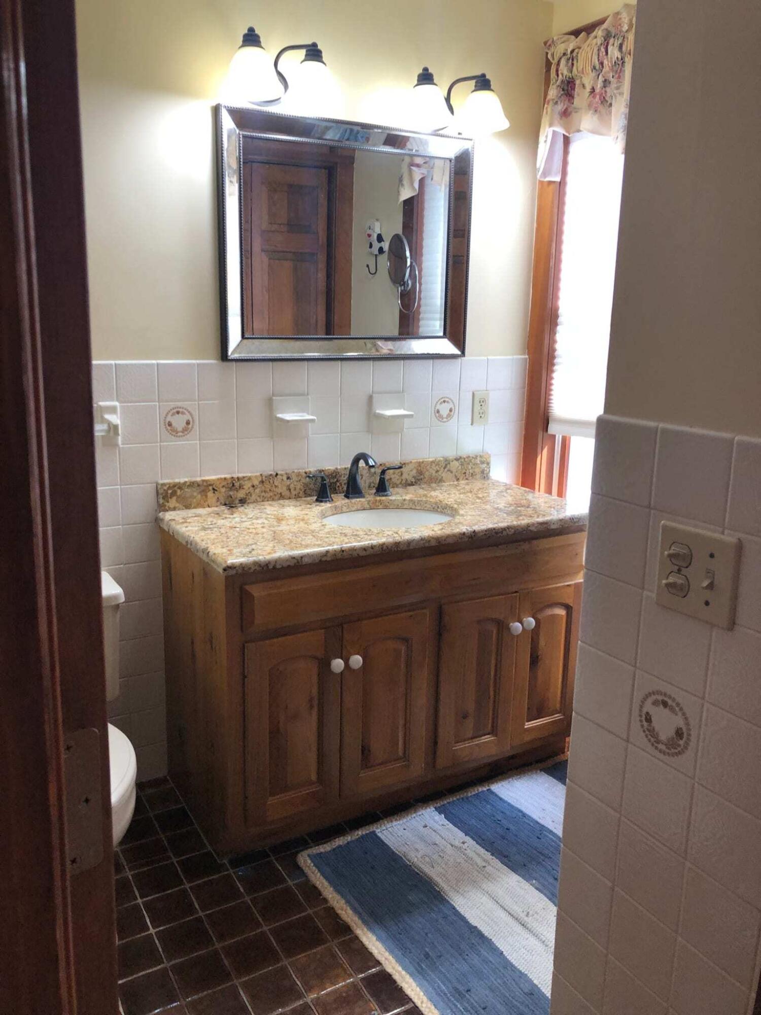 31 Babbling Brook Road Centerville, MA 02632 - Photo 21 of 38 a bathroom with a sink and a mirror