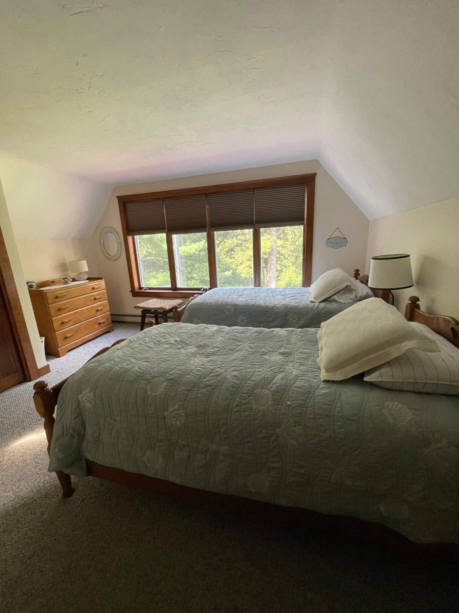 31 Babbling Brook Road Centerville, MA 02632 - Photo 27 of 38 a bed sitting in a bedroom next to a window
