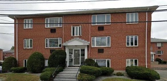 133 Warren Street, Unit 8 Watertown, MA 02472 - Photo 1 of 9 a front view of a house with yard and plants