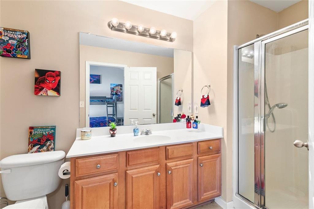 2555 Flat Shoals Road, Unit 5 Atlanta, GA 30349 - Photo 16 of 24 a bathroom with a sink and a mirror